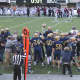 The Old Tappan football team heads to midfield after winning the state title over Wayne Hills Saturday, Dec. 5.