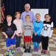 David Adler with third-graders: Ryan Bresnahan, Katie Walsh, Luke Romanowski, Lindy Mueller, Savanna Moore