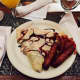Vintage's sweet, chocolate-drizzled crepe with a side bacon and sausages is a popular entree.