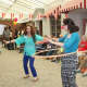 Employees tried the hula hoop at the circus.
