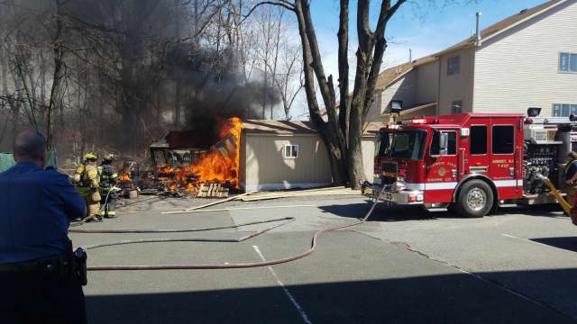 Monsey firefighters are battling a shed and car fire on Main Street.