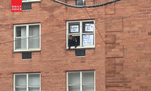 The Hackensack woman apparently had taped signs to her windows.