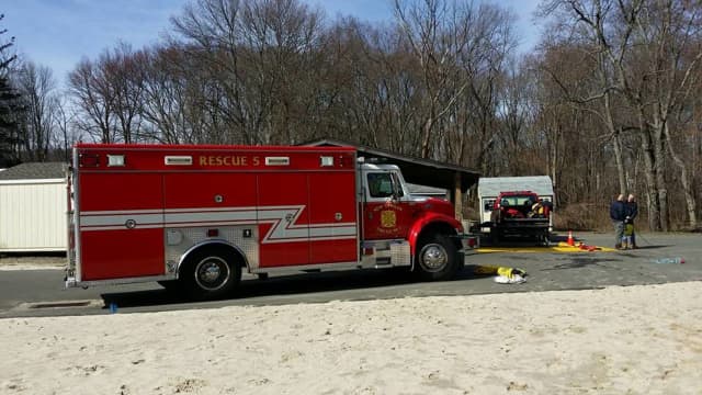 New Canaan firefighters were able to douse a brush fire on Parish Lane South on Wednesday before it spread.