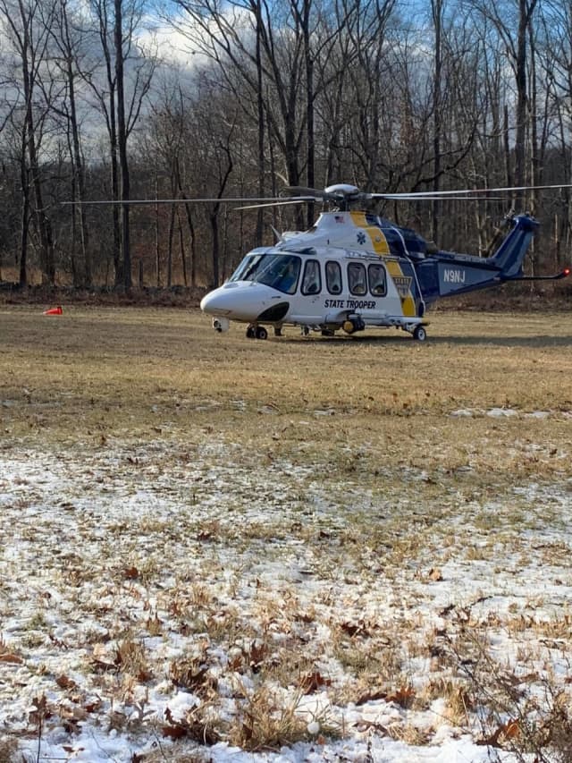 A 58-year-old man was airlifted with serious injuries after getting trapped underneath a tree in Hunterdon County Tuesday afternoon, state police confirmed.
