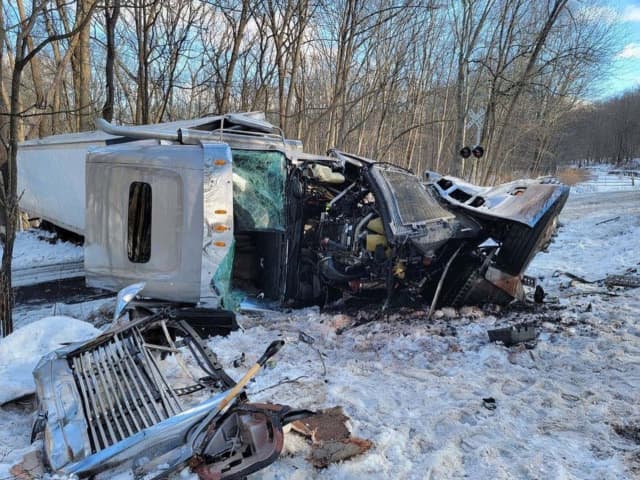 A tractor-trailer driver was hospitalized after the vehicle was struck by a train in Morris County Tuesday morning, authorities confirmed.