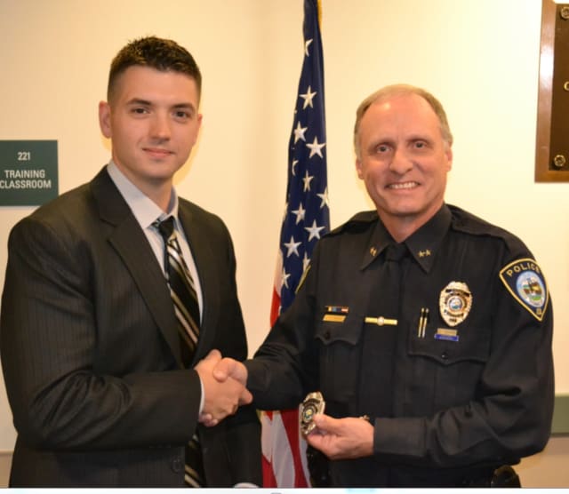 Matthew Ackerman, left, is the newest member of the Darien Police Department.