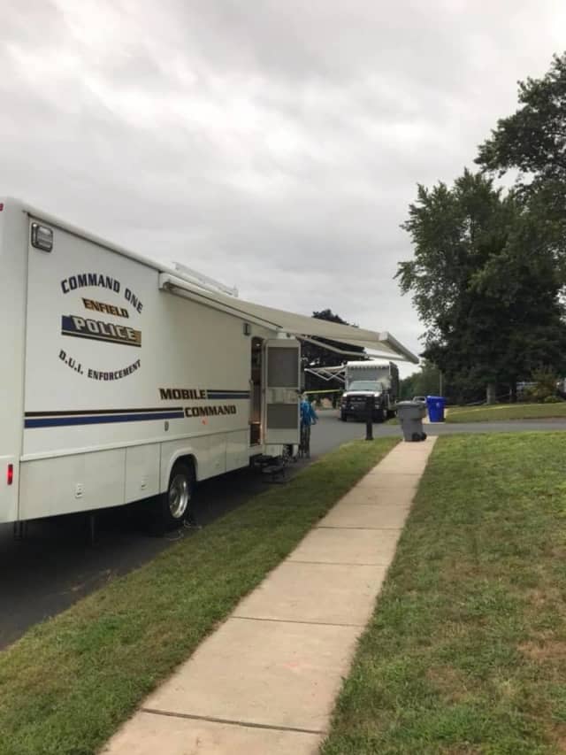 The Enfield Police have set up a mobile command at the home where the teen was stabbed to death.