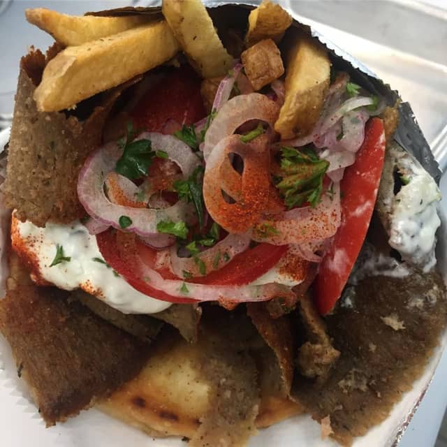 Beef and lamb gyro from Georgy Gyros (120 West Ramapo Road in Garnerville) - Includes sliced red onions, ripe tomatoes, fresh hand-cut French fries and tzatziki sauce.