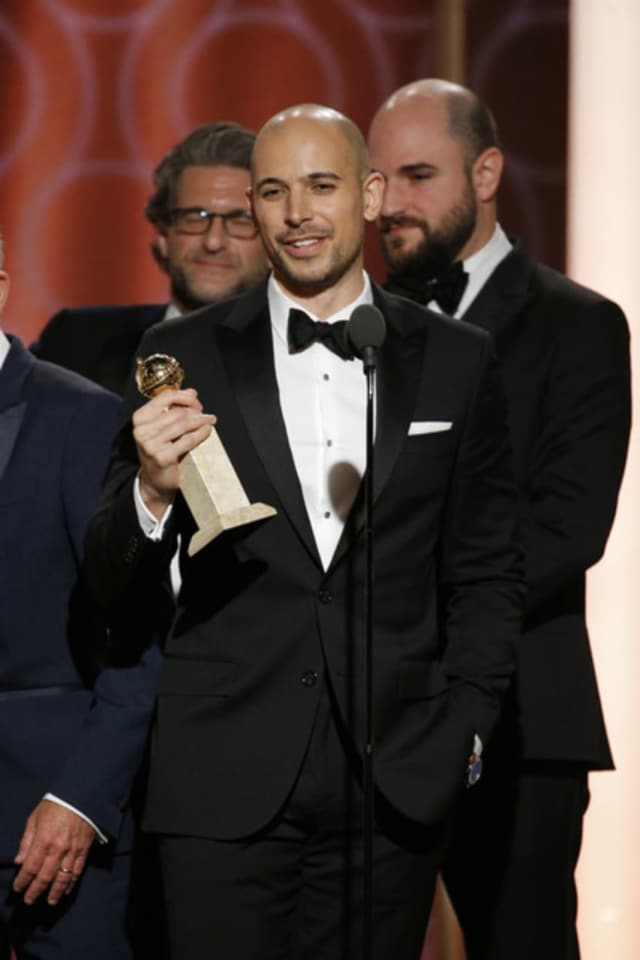 Fred Berger, middle, accepting Golden Globe for "LaLa Land."