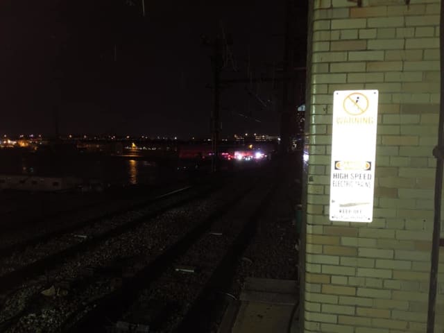 Police lights are seen along the tracks in Harrison near Newark Penn Station Wednesday where a person was struck.