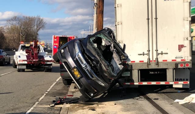The van ended up against a tractor-trailer.