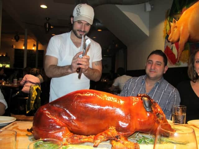 Dave DiBari carving one of his favorite dishes -- pig.