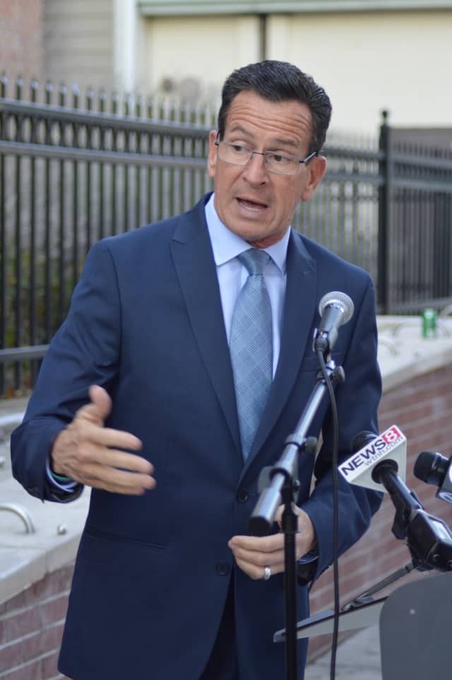 Gov. Dannel Malloy signed an executive order Thursday banning state-funded travel to North Carolina in response to the passage of a law that discriminates against LGBT people.