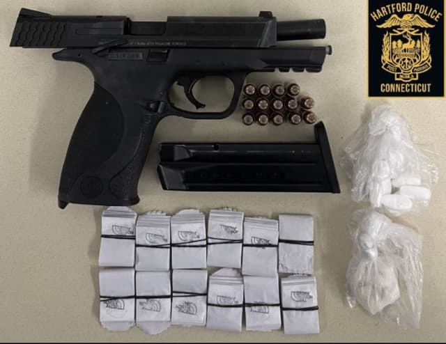 The gun and drugs seized.