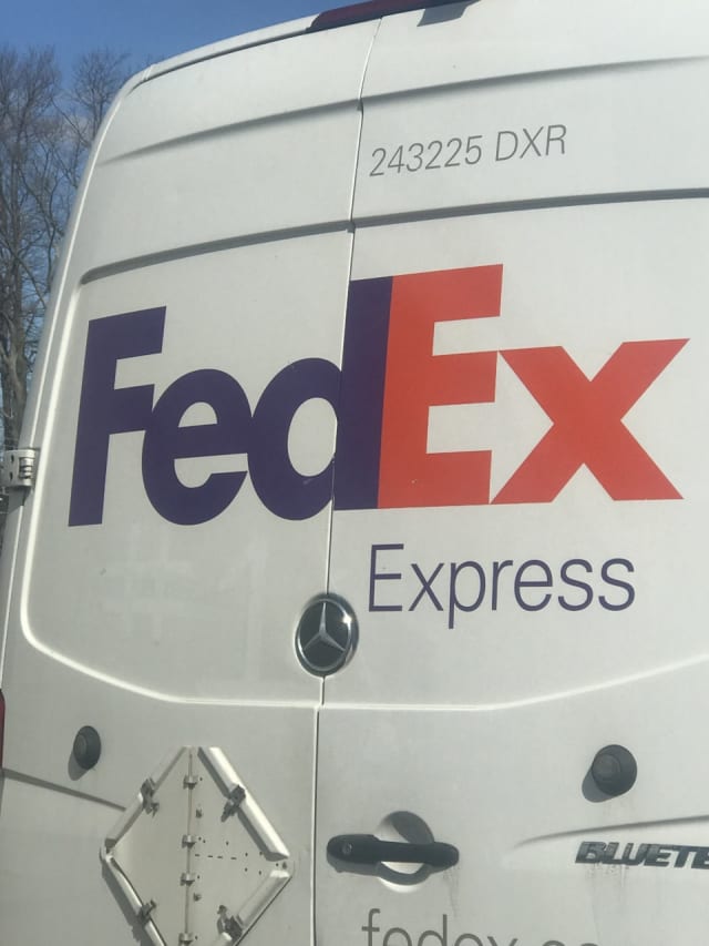 Someone stole a FedEx truck at gunpoint following a collision with another vehicle Monday, police said