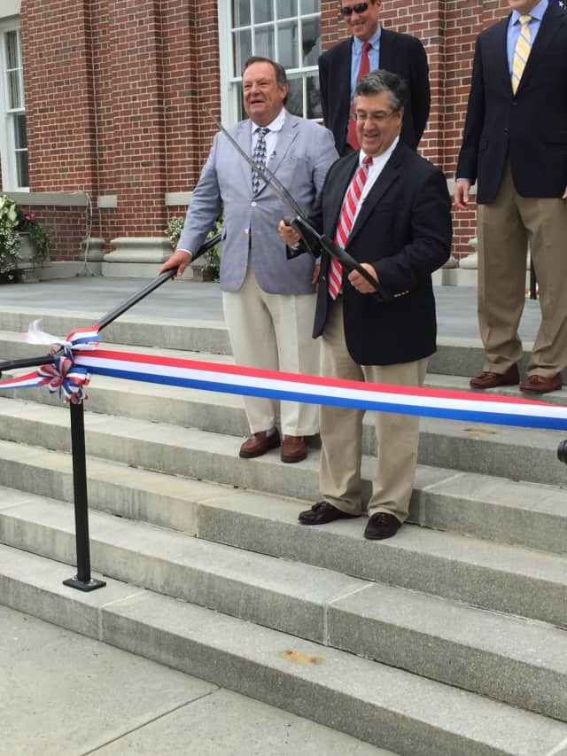 New Canaan's First Selectman Robert E. Mallozzi gets ready to cut the ribbon on the newly renovated Town Hall in September. The town's recent growth spurt has been featured in an article in The Wall Street Journal.