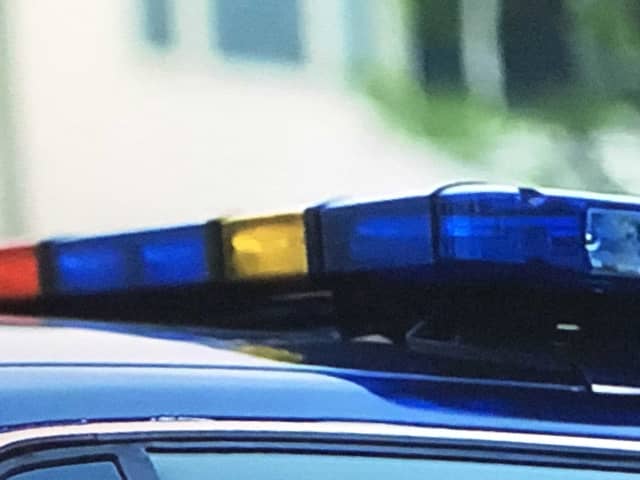 A man who police say is wanted in Stamford has been charged after he allegedly stopped at a series of green lights in Westport while impaired by drugs.