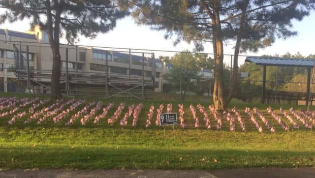 Flags placed at Norwalk High School honor the victims of the 9/11 terror attacks.