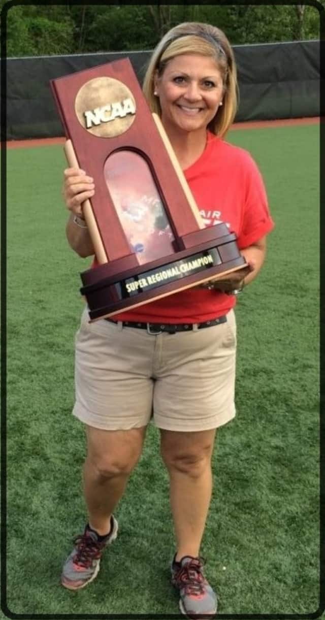 All*Starz owner and Bloomfield College Coach Leslie Korkgy-Valenti proudly holding her team's trophy for winning the 2014 Super Regional Tournament for Montclair State University. Korkgy-Valenti is conducting a winter softball clinic in January.