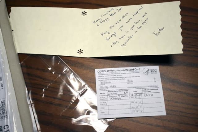 The fake COVID vaccine card was found hidden in a holiday greeting card.