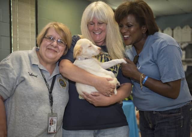 Bergen County Animal & Adoption Center Director Deborah Yankow, Laura Rammelkamp with her newly adopted puppy, and NBC4NY’s Pat Battle.