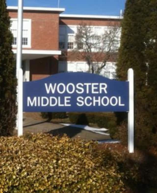 Wooster Middle School was put on a 'stay put' status after a suspicious man was spotted at a school bus stop.