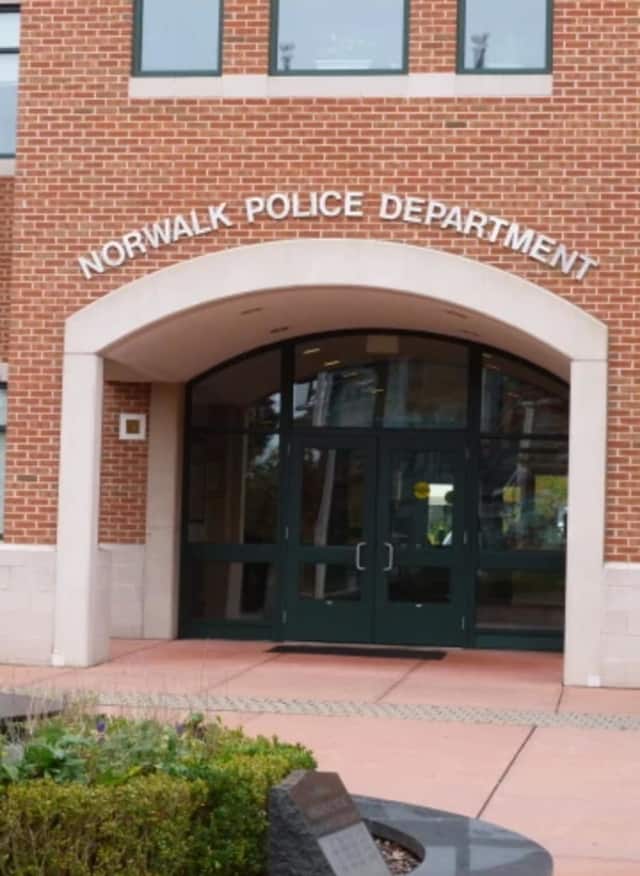 Norwalk Police charged a Darien man with DWI after he is alleged to have struck a police cruiser near the Norwalk Police headquarters late Thursday.