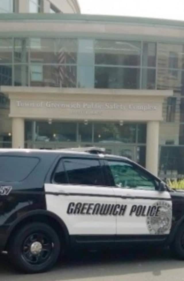 A Greenwich man was charged with throwing a stink bomb against someone's door.