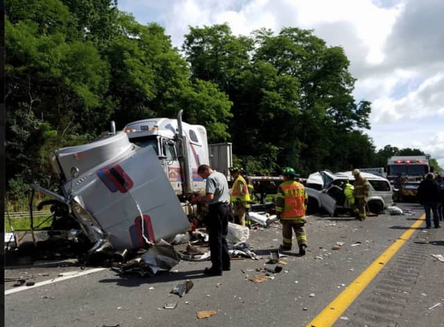 A look at the scene of the crash involving a tractor-trailer and three cars on I-84 in Orange County on Monday morning.