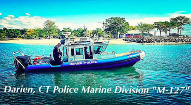 Darien Police Marine Division's M-127 rescued four people from a capsized boat off of Shippan Point in Stamford.