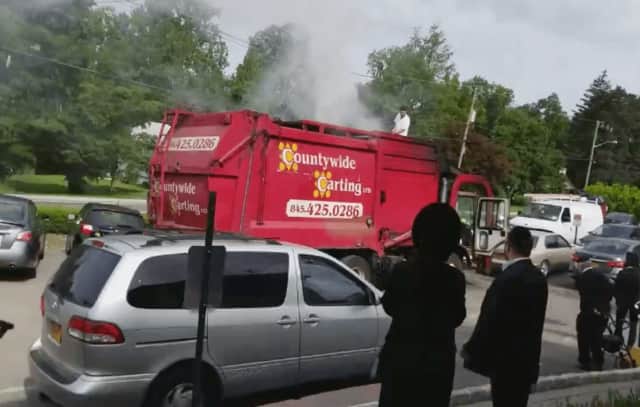 A garbage truck caught fire after hitting an electrical pole.