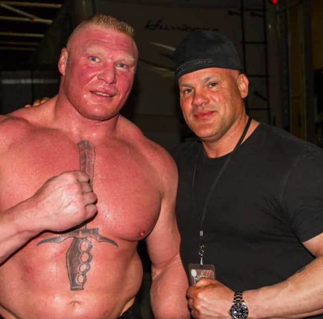 Erik Santiago of South Hackensack, right, with former WWE star Brock Lesner.
