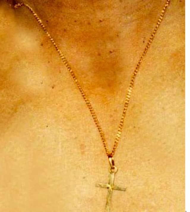 This gold chain with a crucifix was found on the body of a man in a wooded area of Brewster. State police are seeking tips in the 1995 mysterious death.