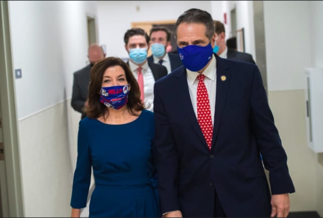 Gov. Kathy Hochul with her predescessor, Andrew Cuomo, on way to a COVID-19 news briefing update in Buffalo on Monday, Jan. 25, 2021, their last known public appearance together.