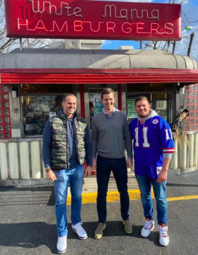 Former NY Giants Shaun O'Hara, Eli Manning and comedian Chris Distefano outside of White Manna in Hackensack.
