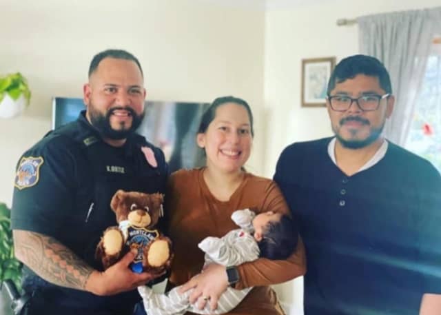 Montclair Officer Ortiz with baby Diego and his parents, Jorkell Echeverria and Lynette Rente.