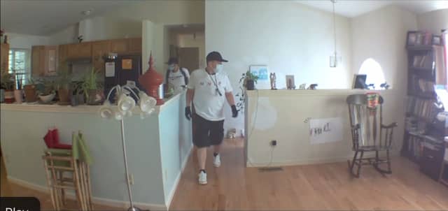 A picture of the suspects inside the home.