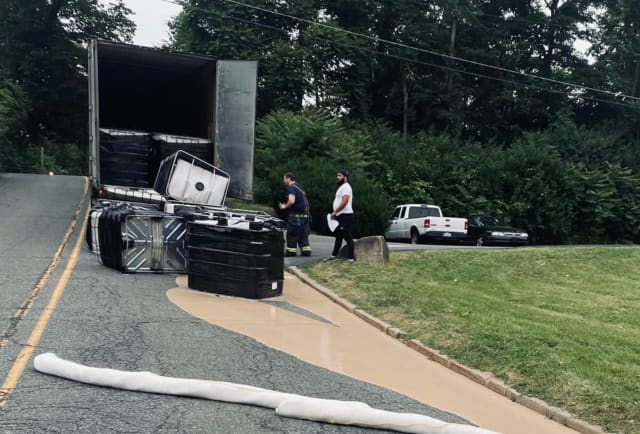 More than 100 gallons of cooking oil were spilled from a truck in a massive HazMat incident in Sussex County, authorities said.