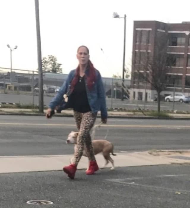 Police are seeking the public's help in identifying the woman in this photo. It is believed her dog was involved in a biting incident.