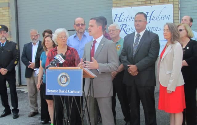 Assemblywoman Sandy Galef, front left, and state Sen. David Carlucci, front right, gather with local officials to announce funding for the Sing Sing Historic Prison Museum in Ossining.