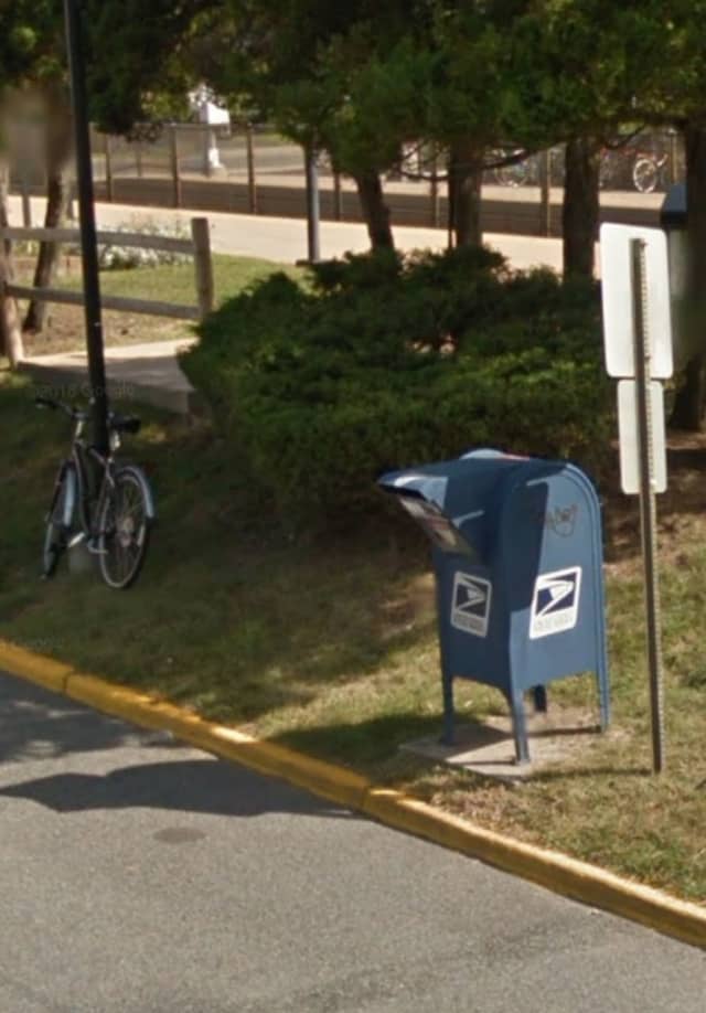 The victim using the US Postal Service mailbox on West Plaza near the Source Building, police said.