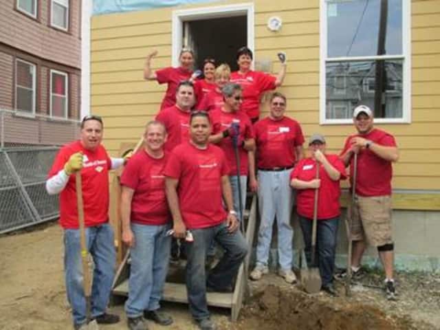 Bank of America employees work on a Stratford Habitat for Humanity house.