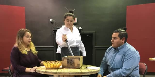 A couple's dinner gets ruined when their fortune cookie has a disturbing message. The performance cast includes, from left, Chloe Blaney, Deanna Prekpalaj and Jovani Perez.