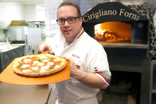 Bruno DiFabio, a six-time World Pizza Champion and owner of Pinocchio Pizza in Wilton, will churn out delicious pizzas all day Tuesday to benefit the American Cancer Society.
