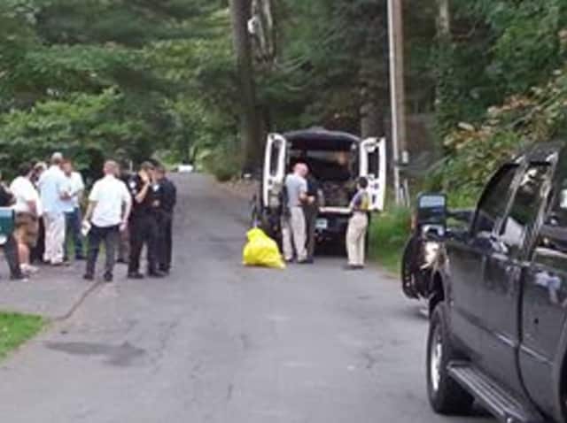 A suspicious substance is removed from a Darien residence by Connecticut State Police. Preliminary testing will be conducted. The scene was released to the FBI, Darien police said.