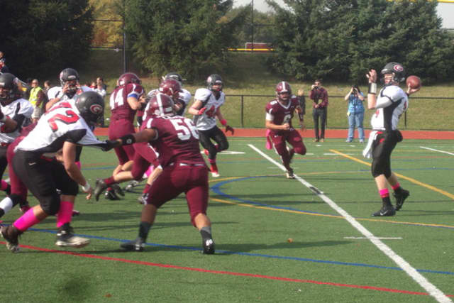 Rye quarterback Andrew Livingston, right, led the Garnets into next week's Section 1Class A championship game against Somers.