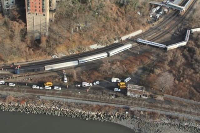 The engineer of the Metro-North train that derailed in the Bronx has been suspended without pay.