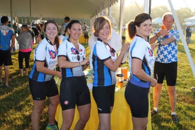 Wilton's Jenn Lewis, second from left, poses with other Team Be Positive riders at the CT Challenge. The team was one of the top fund raising teams in the annual ride.