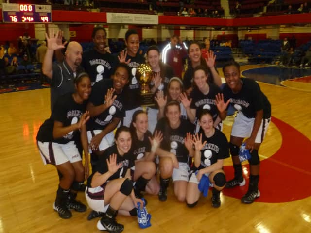 The Ossining girls basketball team seen here after winning the Section 1 title Sunday, won their state regional semifinal game Tuesday in Newburgh.