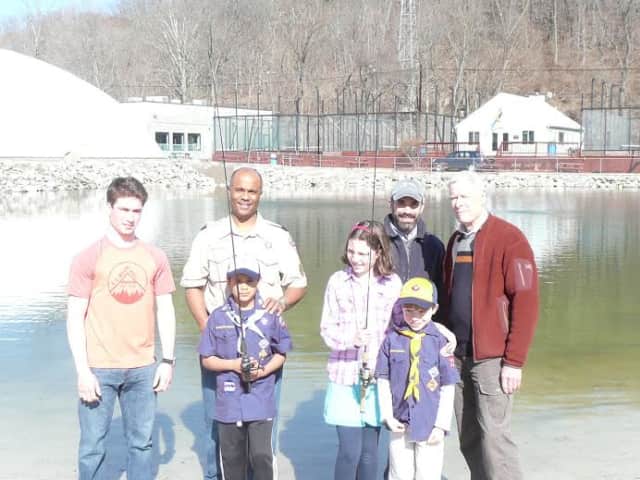 From left are Wilton Fishing Club President Max Jones, Cub Scout leader Reggie Fields, Helen Cherichetti, Lars Cherichetti and Dean Keister of Trout Unlimited. In front are Scouts R.J. Fields and Henry Cherichetti.